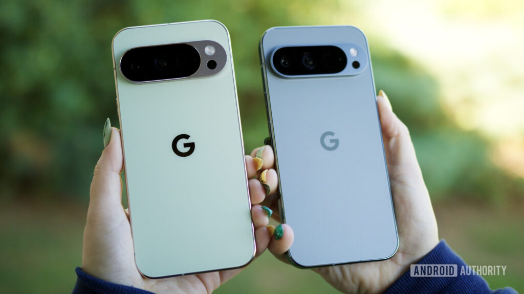 Someone holding the Pixel 10 Pro and Pixel 9 Pro, showing the backs of the phones.
